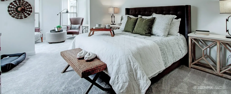 A made bed in a patio home